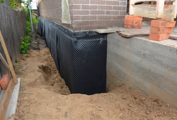 Happy homeowners after waterproofing job in Deerfield
